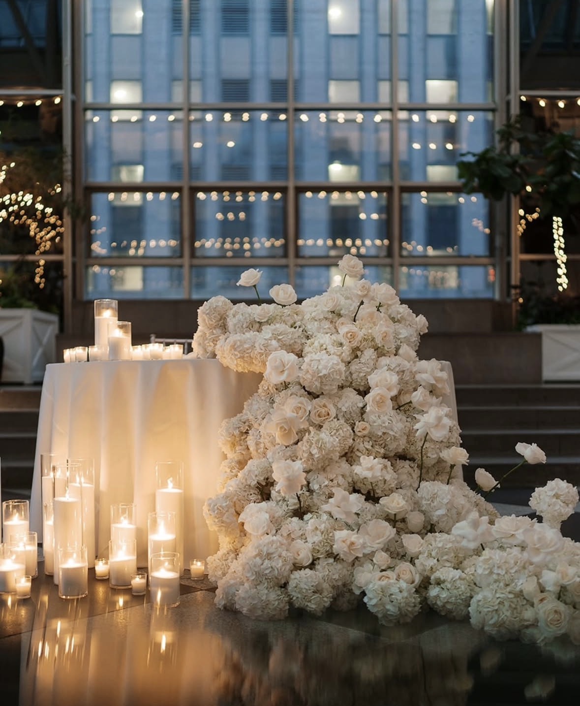 White floral and candle wedding installation