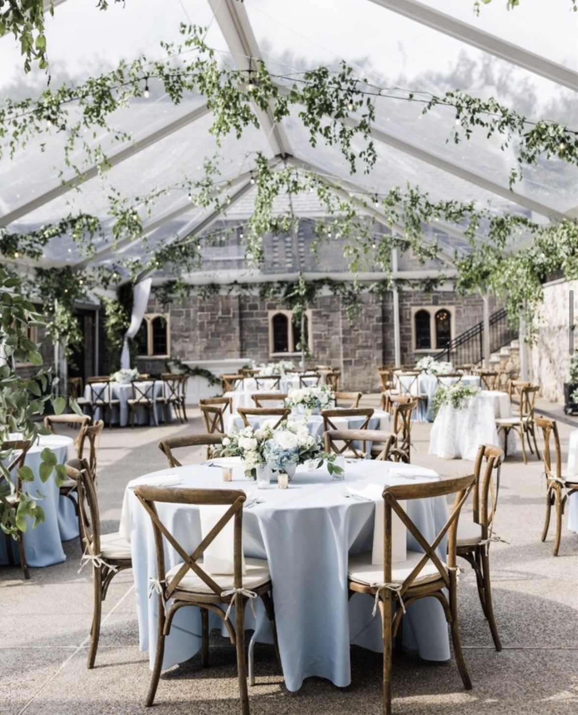 Tent wedding reception with greenery